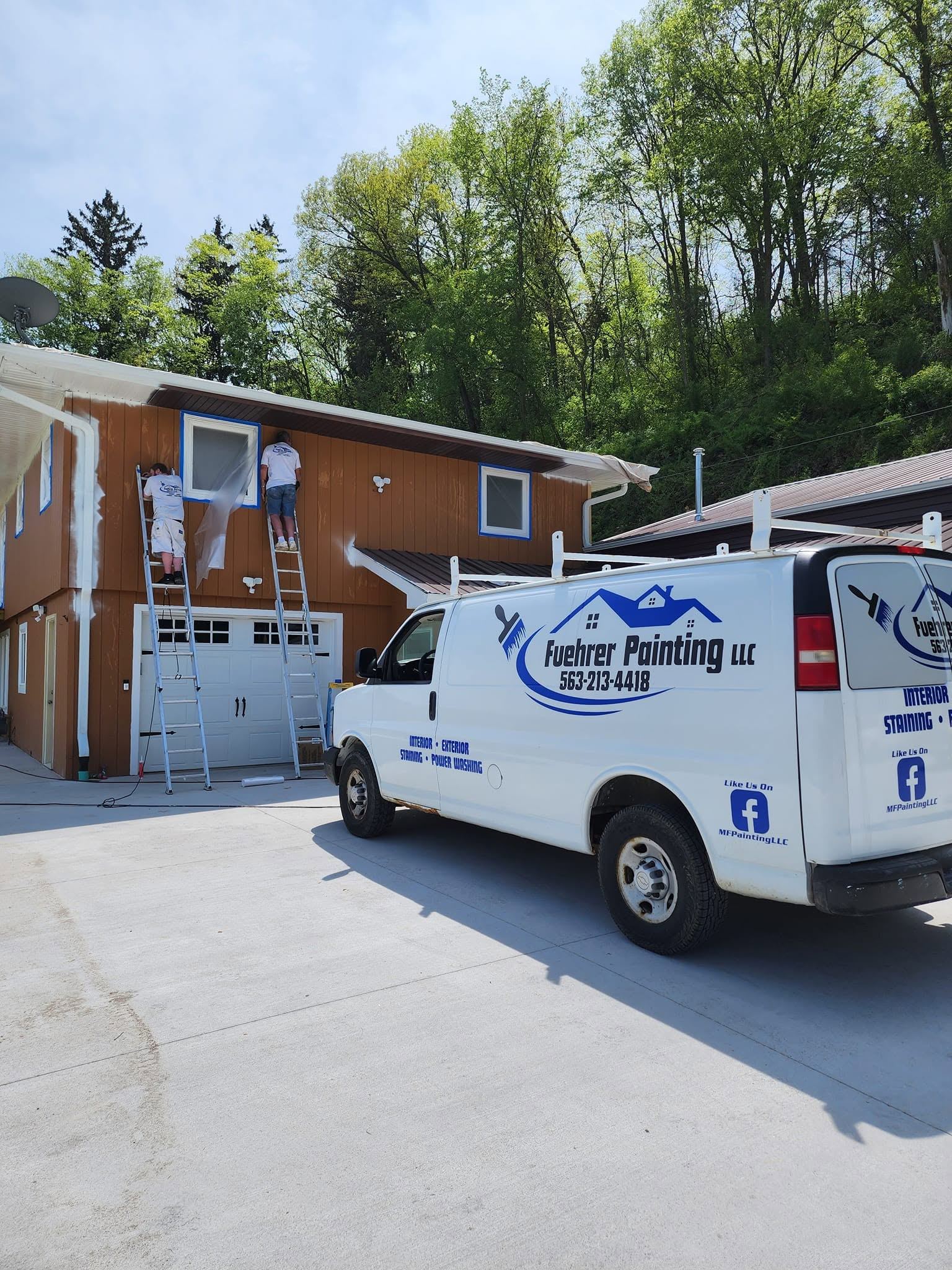 Fuehrer Painting LLC van on job site