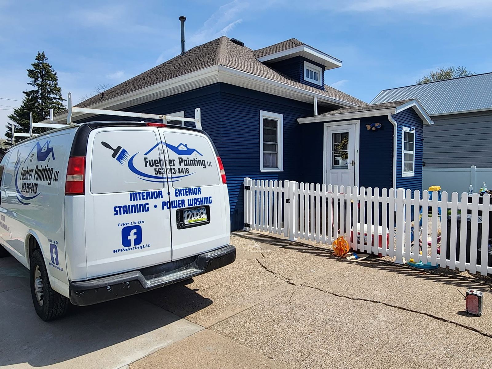 Fuehrer Painting LLC branded van on job site Dubuque Iowa